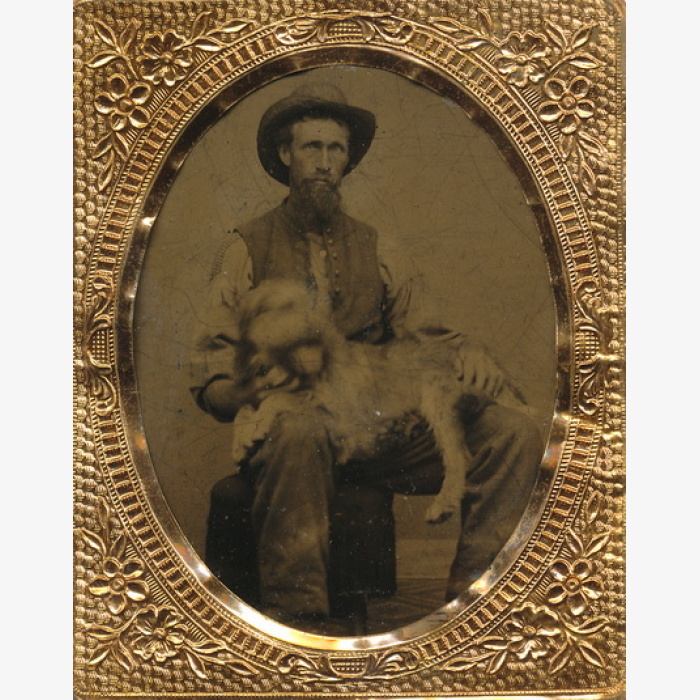 Male Subject With A Dog In His Lap